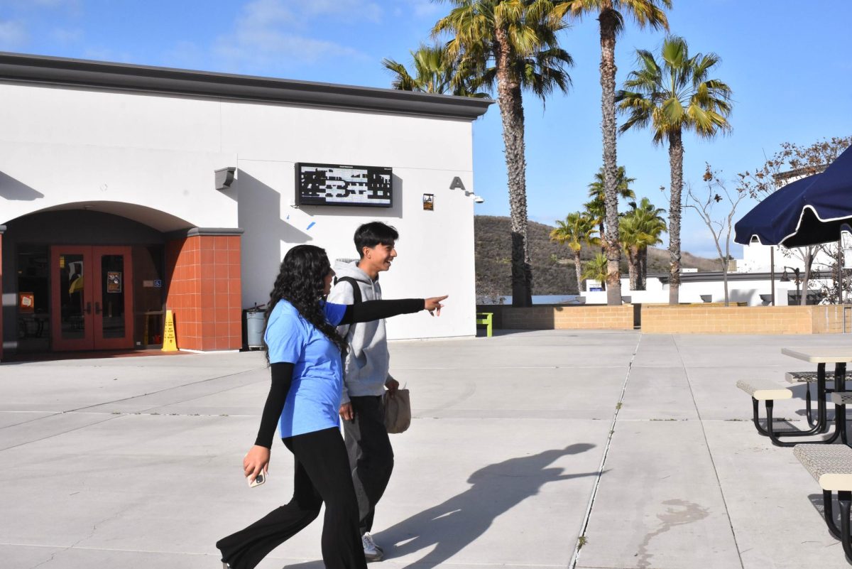 During AVID shadow day, Diana Vega (10) shows her AVID buddy around campus. The AVID program gave tours to incoming freshmen, helping them acclimate to school culture and campus life before entering high school.