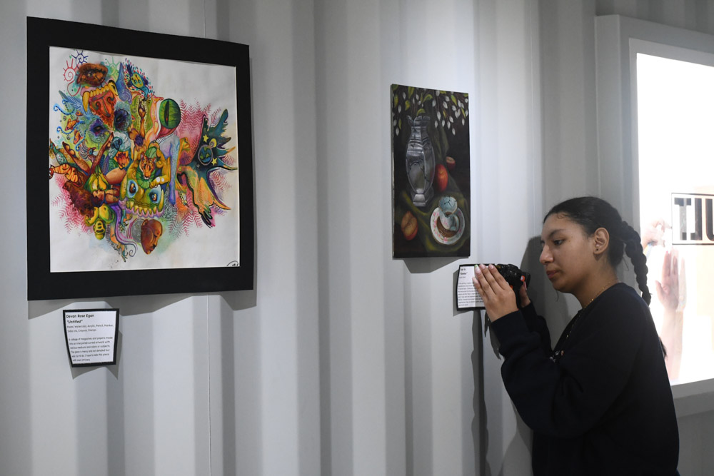 Alba Herrera (11) is preparing finishing touches before the opening.The Vault in the upper quad was opened Friday the 