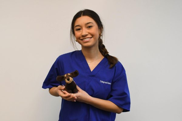 Justine Beaver sports her veterinary tech scrubs. Beaver, like many of her classmates taking the CTE Veterinary Technician course, hopes to pursue a career working with animals.