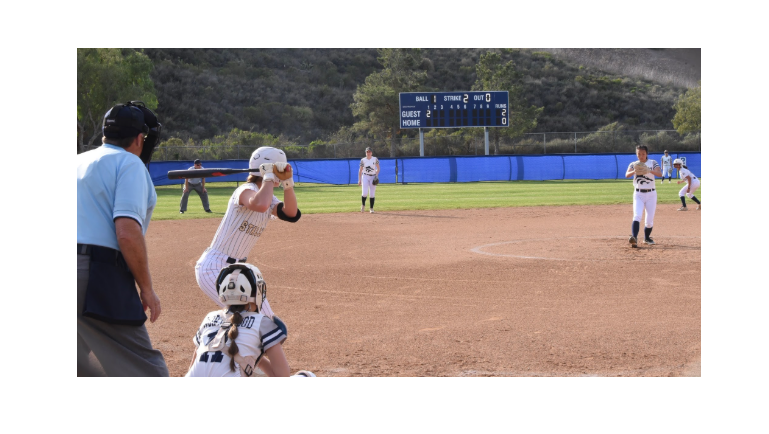 On February 27, Gianna Ioja (12) gets ready to bat the ball on the home plate as the Northwood pitcher gets ready to throw the ball. The Stallions fought hard all game long but the Timberwolves triumphed with a 6-3 win. 