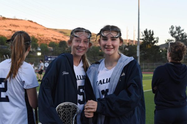 Varsity members, Sovo Vonkaenel (10) and Sadie Duff (10) smile as the team begins their season proudly with another victory.
