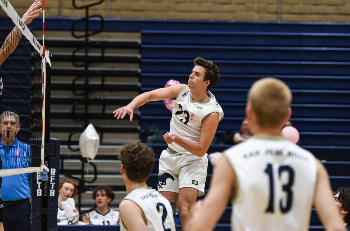 Calm and determined, Boys’ Varsity Volleyball player Zach Smith (12) spikes the ball over the net. The Stallions beat out the La Serna Lancers during this game with a final score of 3-1, claiming another win for this season.