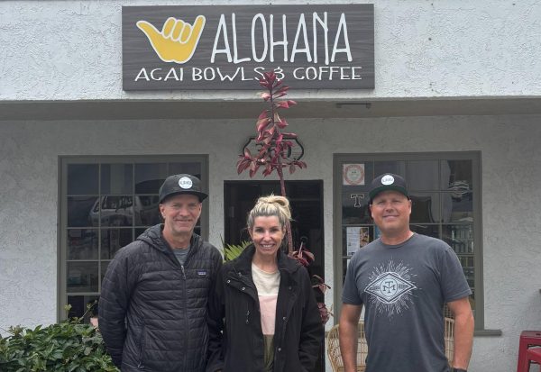 The owners of Alohana Acai Bowls & Coffee, Robert OQuinn, Lucy Williamson, and Casey Rydzeski, stand outside their Capistrano Beach location. Small businesses such as this one have been impacted by the recent tariffs imposed by President Trump. According to OQuinn, he has seen the cost go up on basic necessities such as “bowls, fruit, and acai.” 