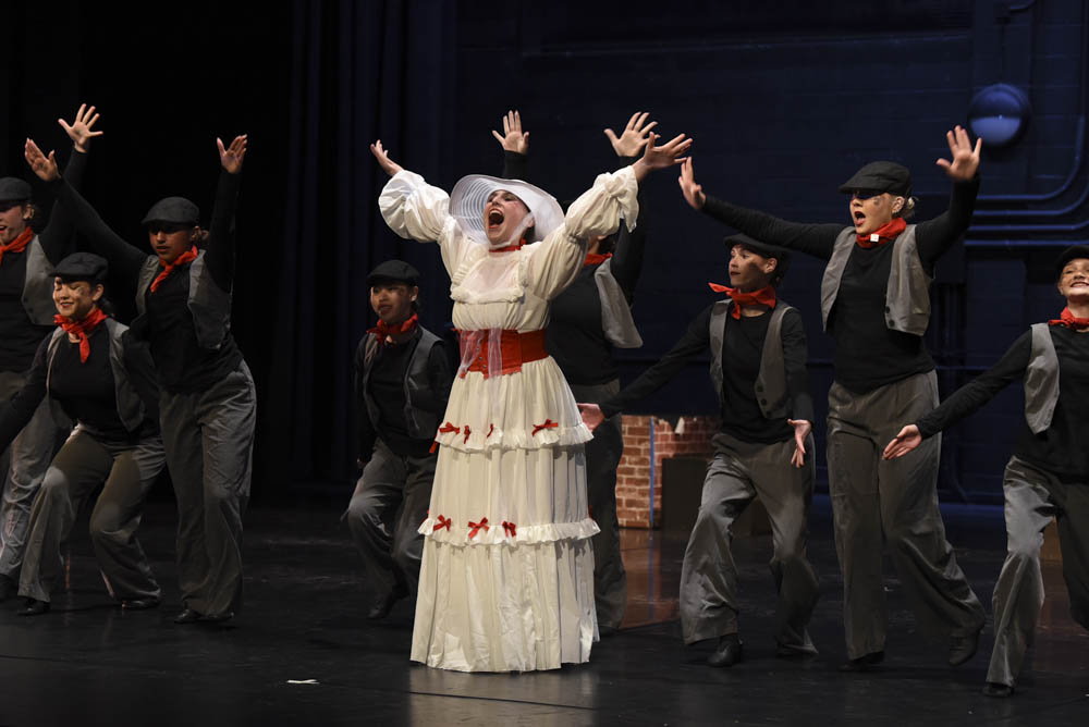 The beloved childhood movie, Mary Popins, is transformed in this nosologic dance, bringing energy and child-like wonder to the stage. Megan Clatfelter (12) who plays Mary Popins poses with the chimney sweepers as they close the curtain