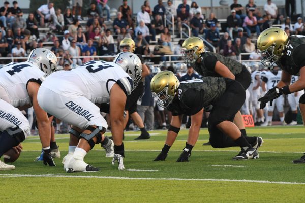 Stallions face off against Oceanside High School in a high stakes football game. Players, Landon Grant and Bryce Bockler (12) got in position to start. 