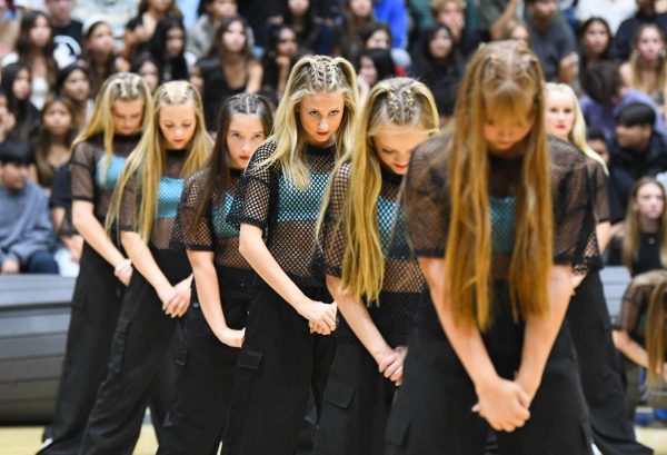 Lining up for their dance routine in the pep rally, Tatem Altman (10), Lilyana McFarland (9), Lola Earnest (10), and their fellow squad members stand straight and focused to perform. They show off their skill and preparation, even with the short amount of time they learned their choreography for the new year.