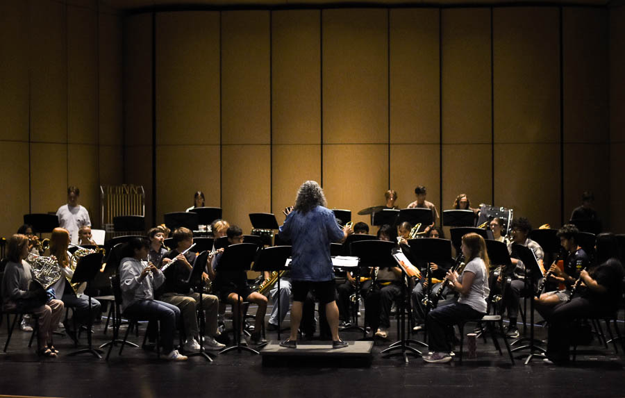 Concert Band Conductor Dean McElroy directs his students for the upcoming fall concert. All instruments followed his lead as he conducted a new piece, “The Great Rubber Chicken Gallop”.