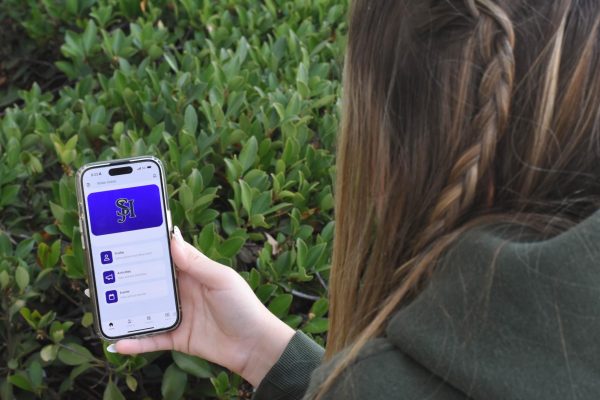 Student Katelyn Johnson (12) pulls up the 5 Star app to show her ID card. This app allows students to have their ID if they don’t have the physical copy with them. It is recommended that Students have this app in order to leave campus if they have a free period.