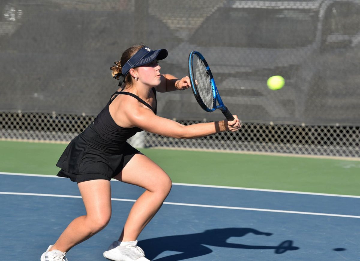 Our school's girls’ tennis players take the court in a competitive match against Beckman High School, with Stallions winning 10-8. Stallion Madeleine Castiglione volleys the ball back over the net to the other team. 