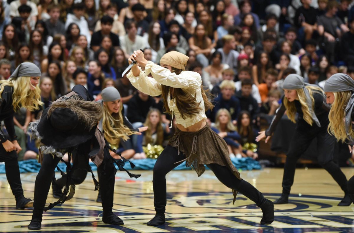 There's multiple antagonists in Pirates of the Caribbean such as the British royal navy and other groups of rival pirates, all of which have one enemy in common, Captain of the Black Pearl, Jack Sparrow.  During the fight scene between Jack Sparrow’s crew and rival pirates, Reagan Roberts (10) gets ready to stab her foe with a knife. 