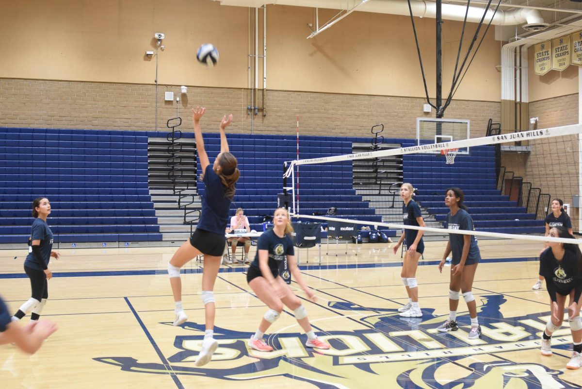 During girls’ varsity volleyball practice, Emma Owens (12) delivers a perfect set for her teammate to score the point. With focus and determination, the team works hard in order to translate a high level of play during practice to a high level of play during league matches.