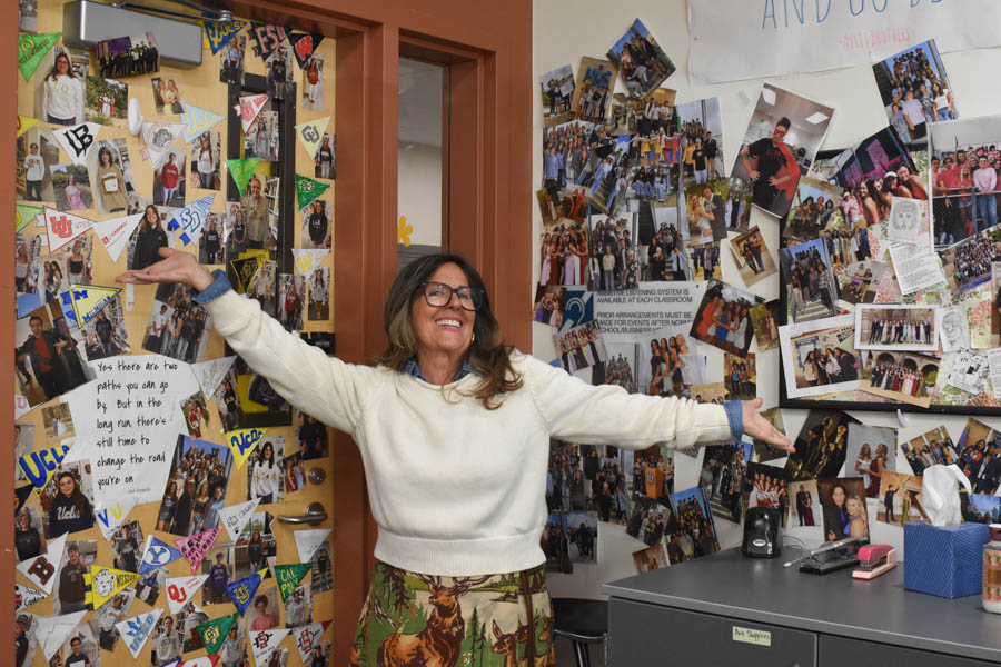Posing with a bright smile, Christine Bak-Boychuk radiates joy in front of the decorated walls of her classroom. As she prepares for retirement, Bak-Boychuk reminisces on her teaching career. 