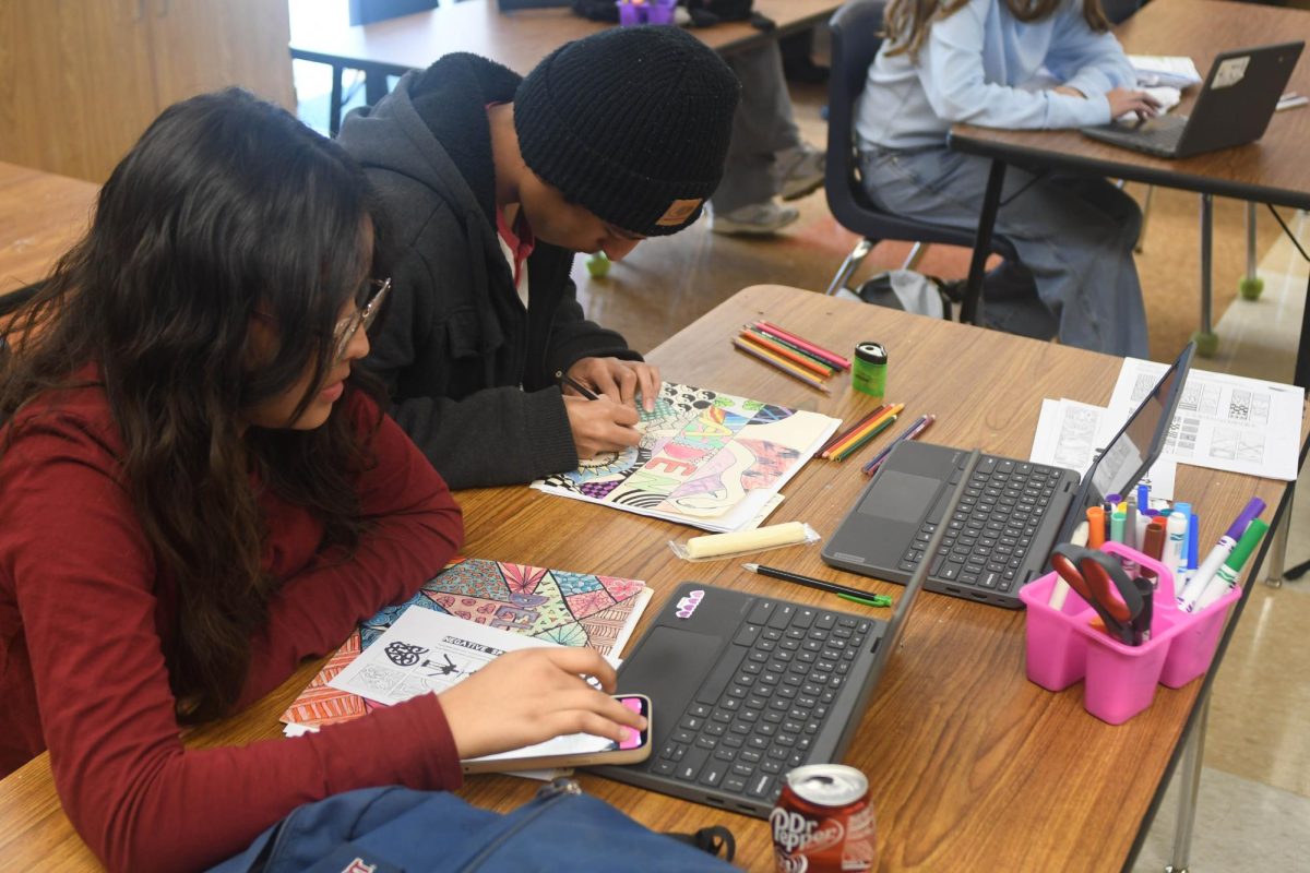 Students work intensively to complete their art work on time. This art class exposes students to what a typical art class can be and to see what types of art they enjoy doing while allowing them to express themselves in the process.