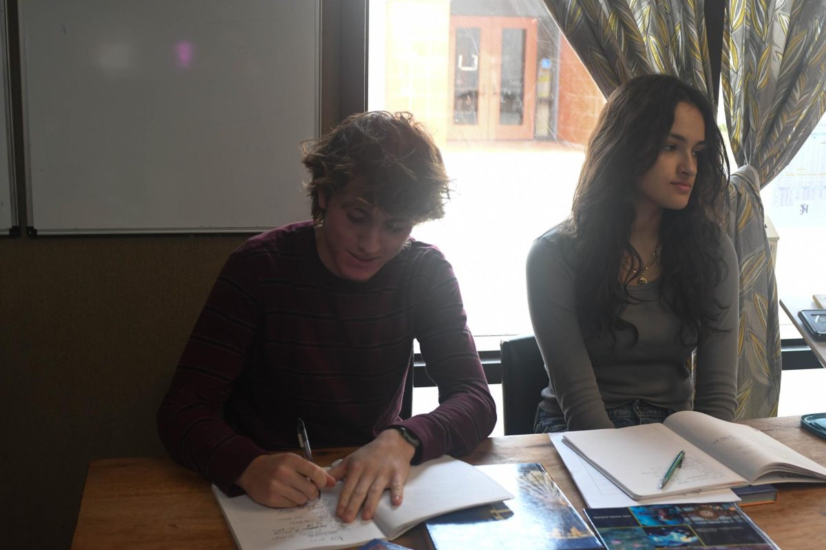 Students work hard with their teacher nearby, expanding their French horizons.