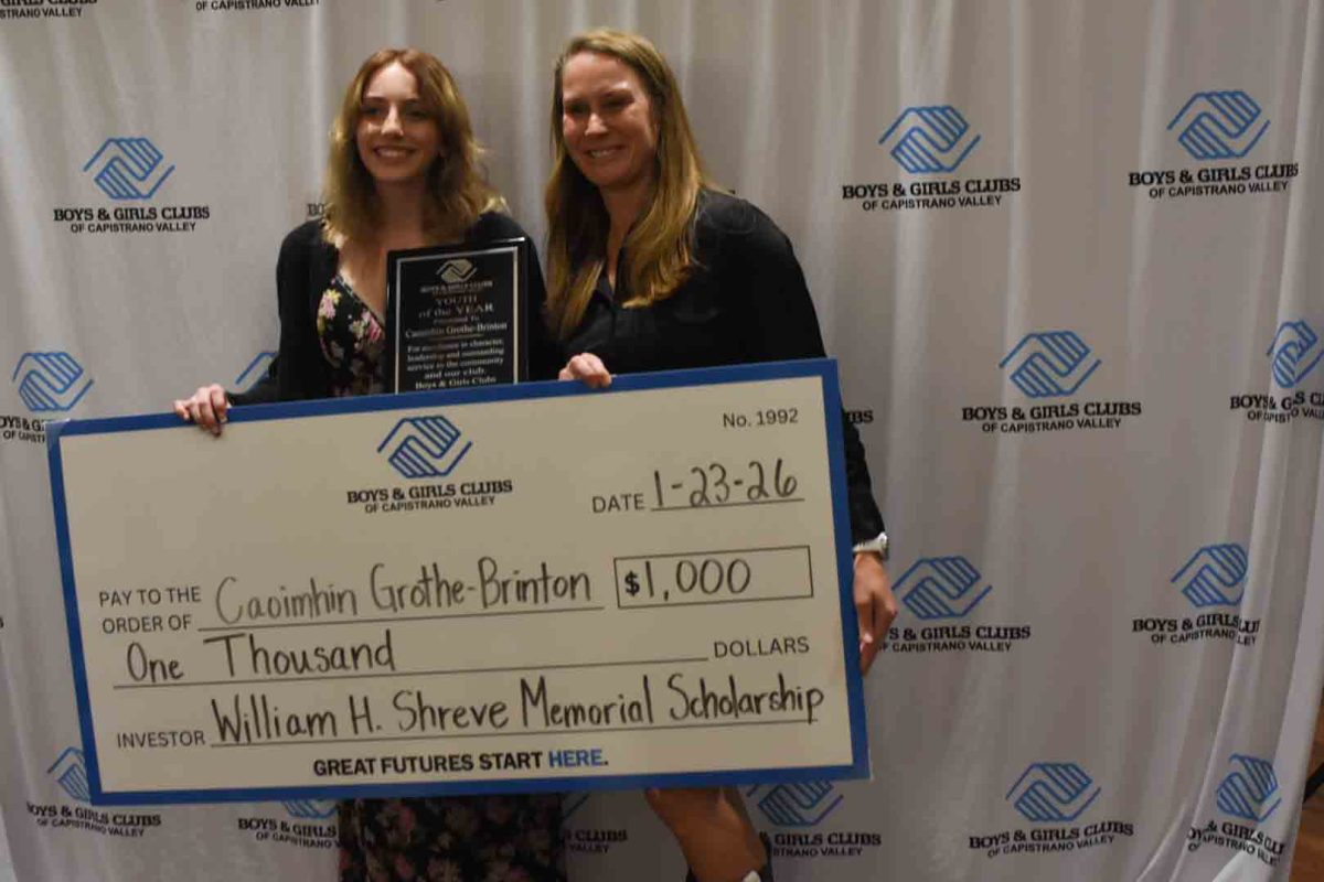 At the San Juan Capistrano town hall a ceremony for local Boys & Girls Clubs, Capistrano Valley, Rancho Santa Margarita, and Aliso Viejo was held. San Juan Hills seniors Allison Canchola and Caoimhin Grothe-Brinton had to compete for a scholarship that declared them a youth advocate as well as winning $1000. Grothe-Brinton (left) is next to Nicole Watson, the Executive Director posing with her big check.  Photo courtesy of Adriana Mora.