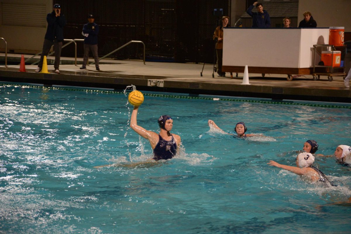 Girls Varsity Water polo player, Eliza Walburger (12), gets ready to shoot a goal against opponent Crean Lutheran high school while in the run for the CIF title. The stallions pulled through ending the game with a victory, advancing to the quarter finals against Glendora high school.