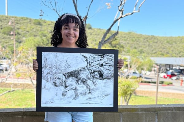 Ava Hankins poses with her art project, 'Man's Best Friend' which she submitted to the Congressional Art Commission competition. Her work advances to a second round of judging and Congressman Mike Levin will announce the winners at a special event on April 2 in Oceanside. The winning artists will be presented with checks for $500 for first place, $300 for second place and $100 for third place.  All artists whose work was selected for the museum display will be given a certificate recognizing their achievement and a photo opportunity with the Congressman. The art awarded first place will be shipped to the US Capitol to be put on display for one year. Also, the winning artist will receive two roundtrip plane tickets to Washington, DC to attend the national Congressional Art Competition reception on June 25, 2026.
