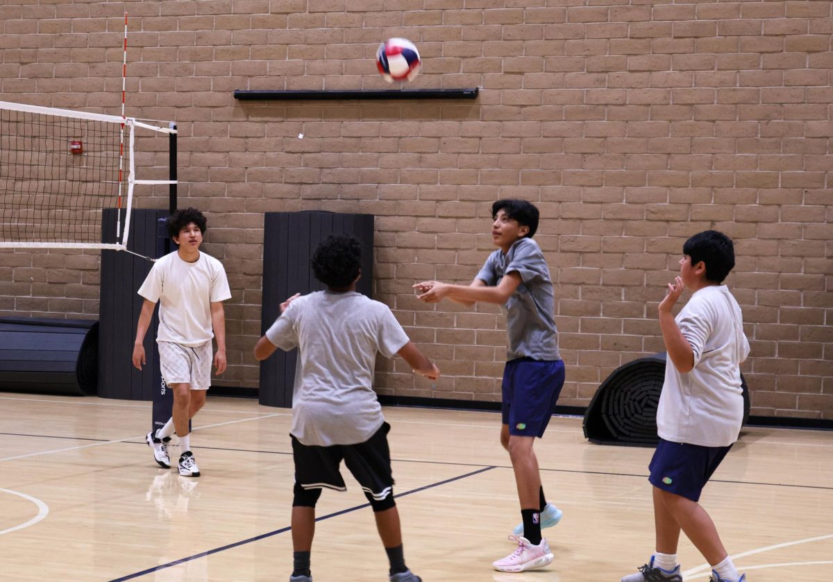 Boys Volleyball team practices volleying the ball to each other. Stallions in the volleyball program practice for their upcoming matches by participating in multiple practice drills. 
