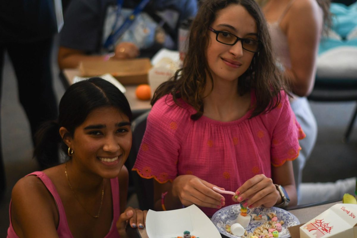  This week’s Best Buddies meeting was St. Patrick’s Day theme. Sahila Nolan (12) smiles with her buddy as they make a rainbow out of pipe cleaner, marshmallows, and fruit loops.
