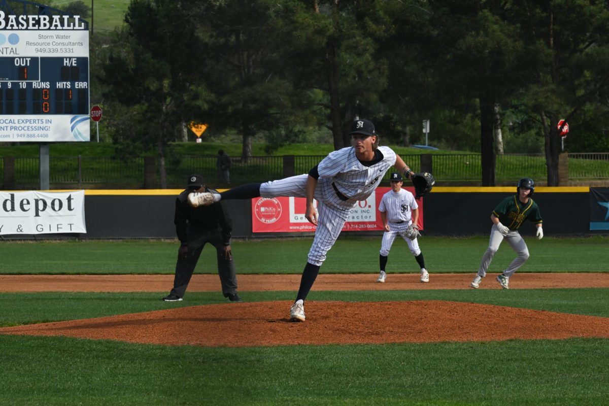 Pitcher Cam Morrison throws a ball towards the batter in a swift motion in this game against Irvine High School. 