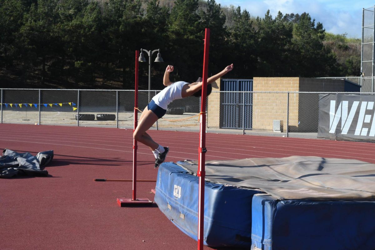 Senior team captain, Kaiya Balcom (12) is warming up for high jump. This event is rigorous and takes a lot of training. 
