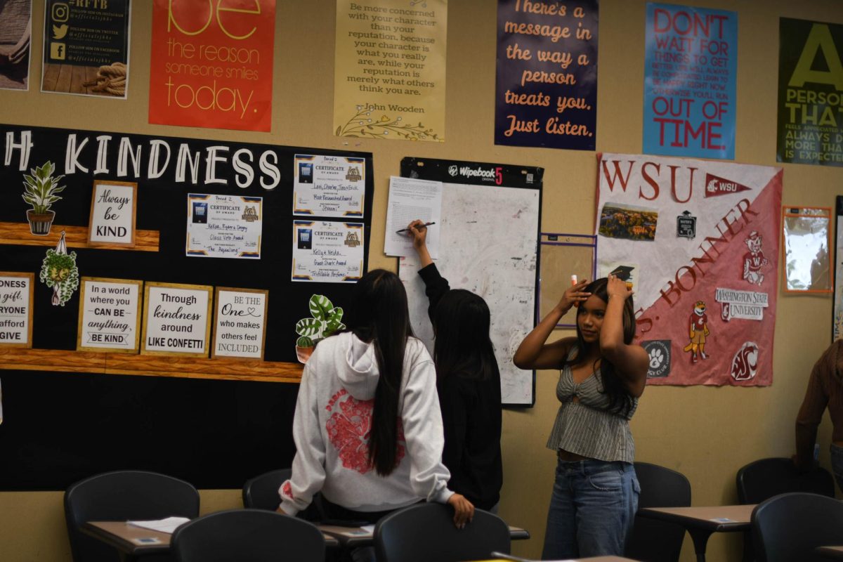 Three students in Mrs. Bonner’s math class practiced their newly learned skills on whiteboards to prepare for their upcoming test. Many teachers use a whiteboard technique to prepare students with recent lessons because it gets students to collaborate and up out of their seats for a new and different learning environment.